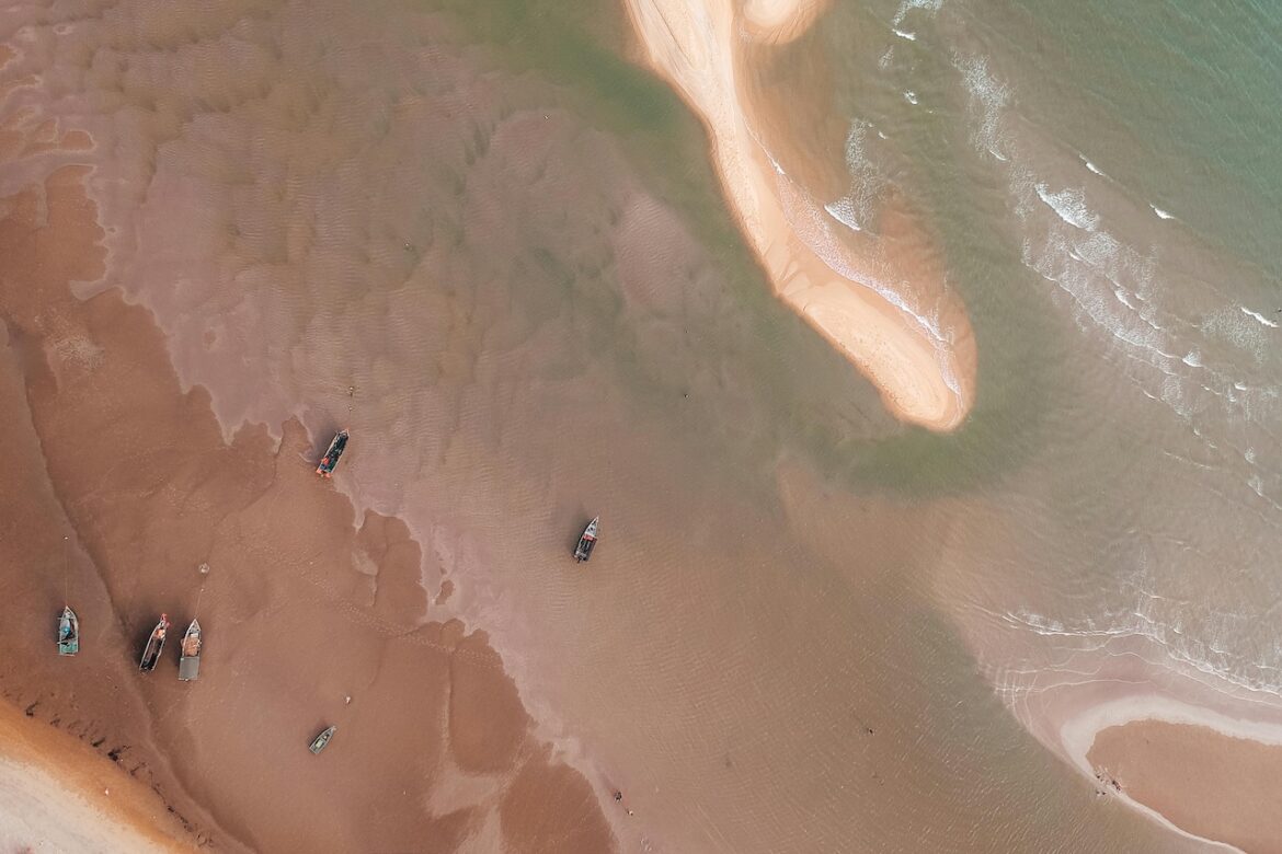 The picture shows the sea at low tide when the boats are stranded and unable to take you to your next destination. It represents saying no when your energy is depleted or when you no that it won't respect your values.